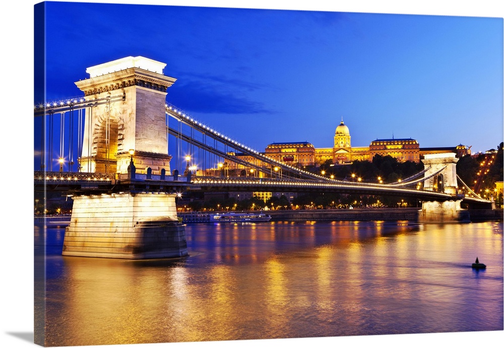 A view of the Chain Bridge over the river Danube at night.