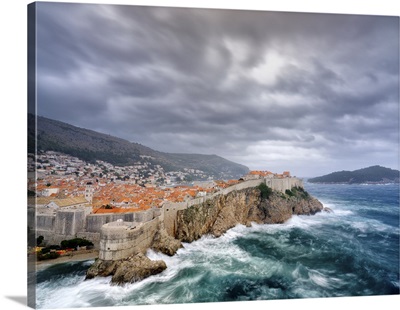 A View Towards Dubrovnik Old Town With Stormy Seas Below The City Walls