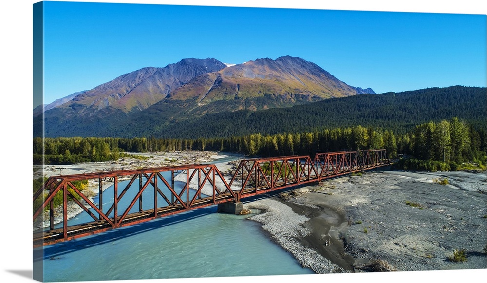 An aerial scenic of the Alaskan Railroad trestle crossing the Snow River on a sunny summer day in South-central Alaska; Al...