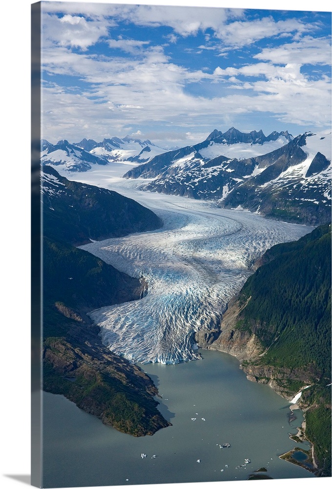 Mendenhall Glacier winds its way down from the Juneau Ice Field to Mendenhall Lake, where the face of the glacier terminat...