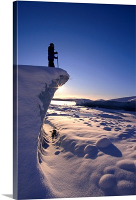 Alaska, Juneau, Mendenhall Glacier, Nordic Skier Stands On Cliff At Sunset