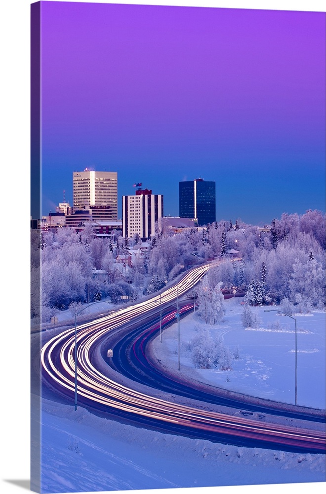 Alpenglow Over The Anchorage Skyline With The Lights From Traffic On Minnesota Blvd. In The Foreground During Winter, Sout...
