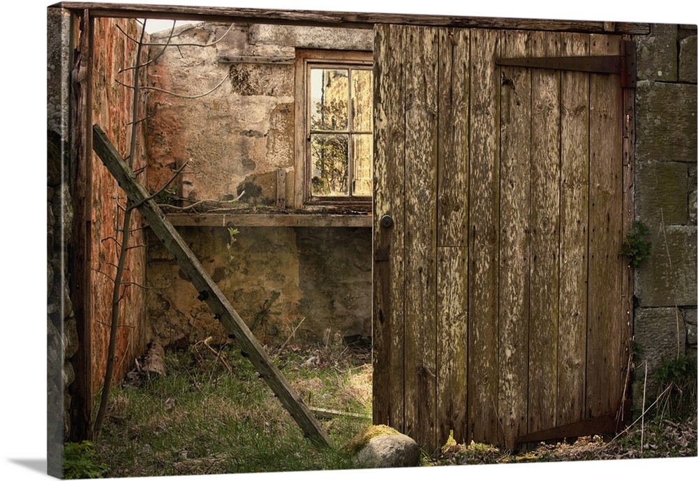 An Abandoned Building In Ruins With A Broken Wooden Door, Northumberland, England