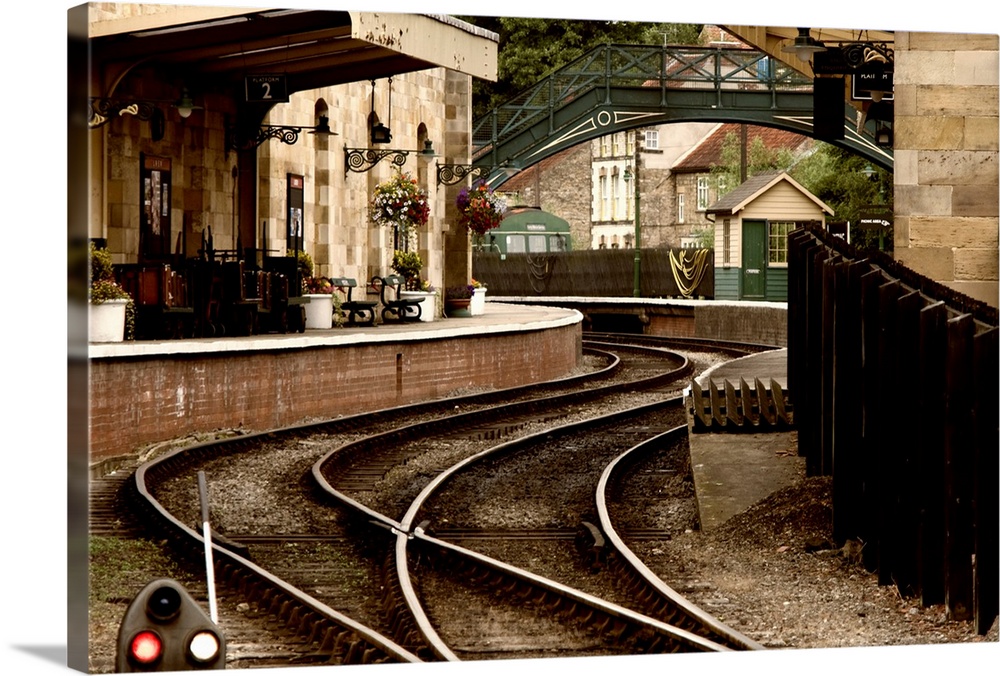 An Old-Fashioned Train Station And Tracks.