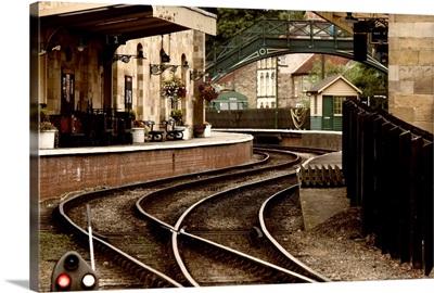 An Old-Fashioned Train Station And Tracks