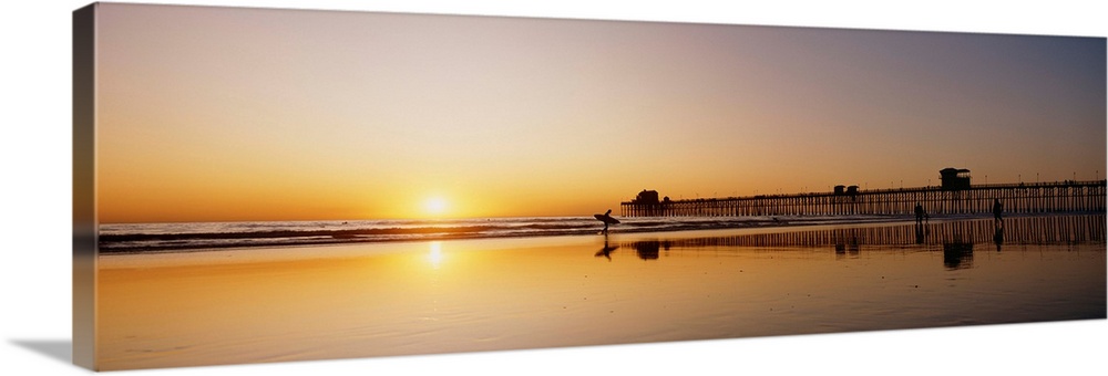 California, Oceanside Pier And Surfers Silhouetted Against Sunset