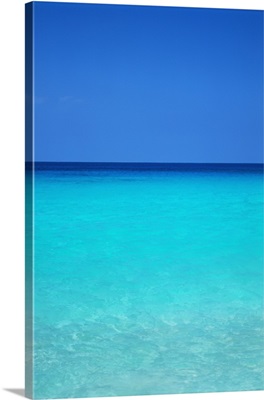 Calm Turquoise Ocean Water To Horizon, Clear Blue Sky
