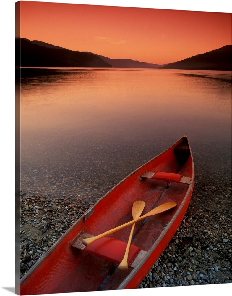 Canoe At Edge Of Mountain Lake, Shuswap, British Columbia, Canada