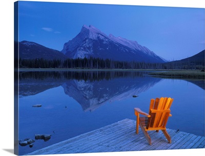Chair On Deck Overlooking Lake And Mountain; Canada