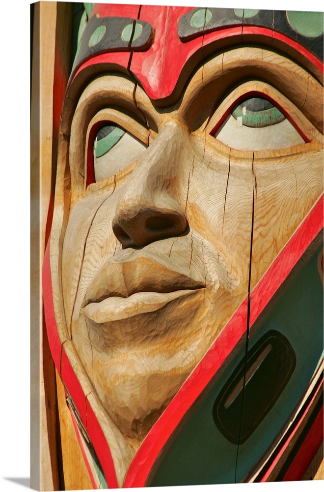 Close up of a face on a traditional Haida totem carving in Ketchikan, Alaska.
