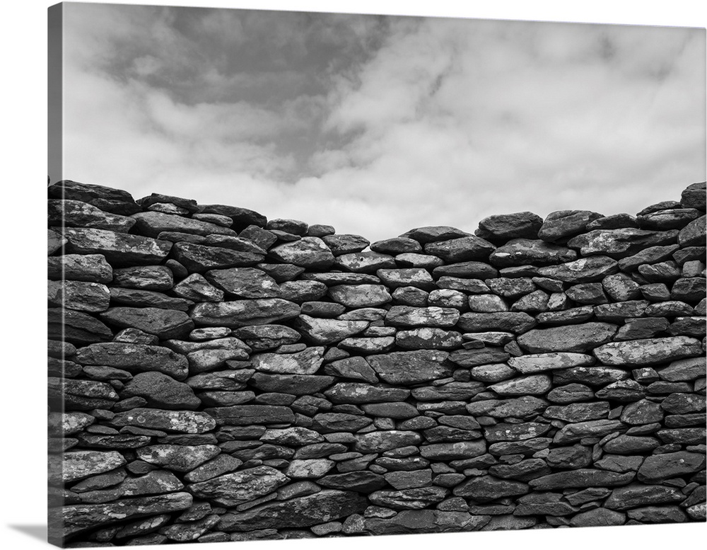 Close-up of a stone wall and clouds in the sky, Ballyferriter, county Kerry, Ireland.