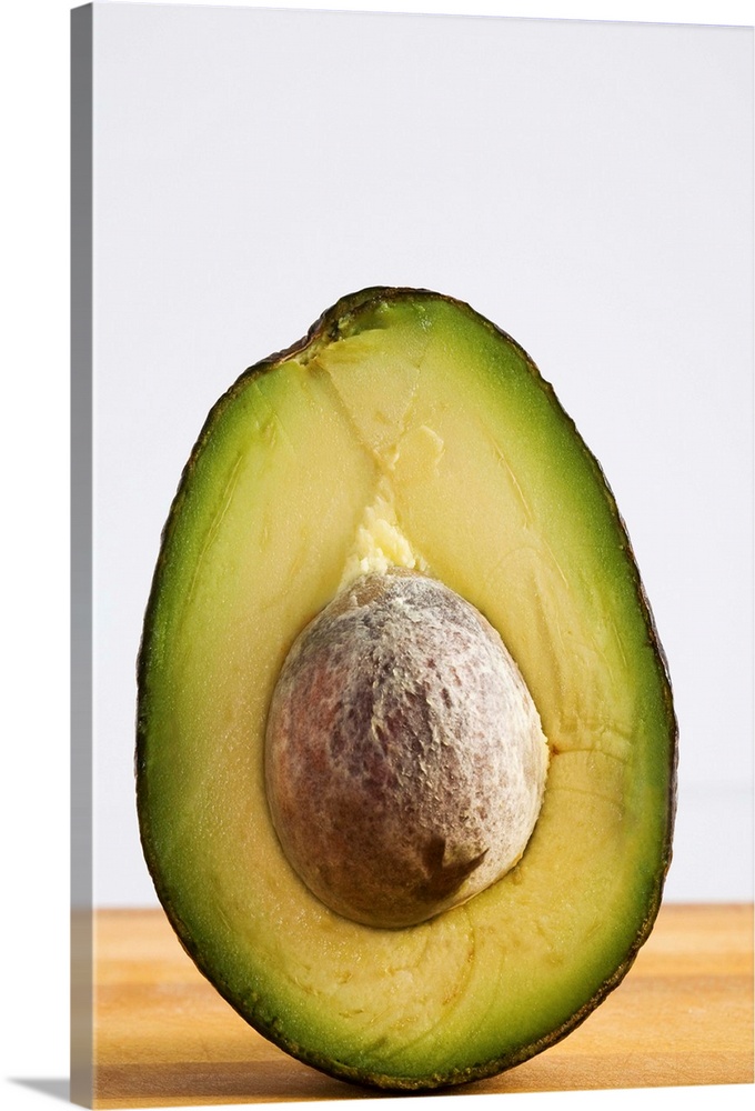 Close Up Of An Avocado Standing Upright Cut In Half With The Pit
