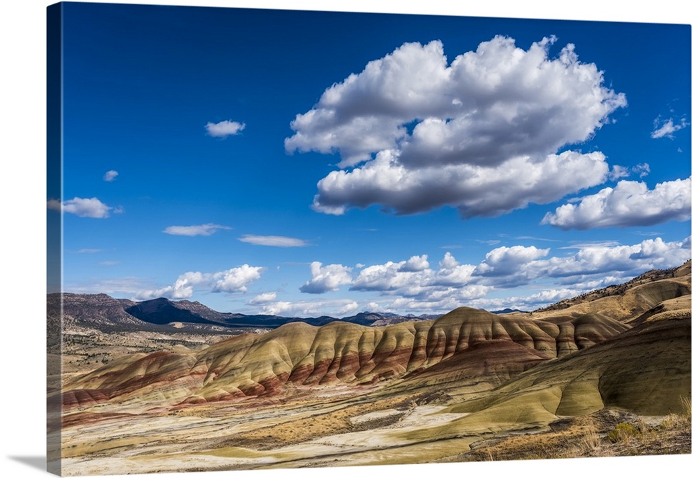 Clouds float above the Painted Hills Unit of John Day Fossil Beds National Monument; Mitchell, Oregon, United States of Am...