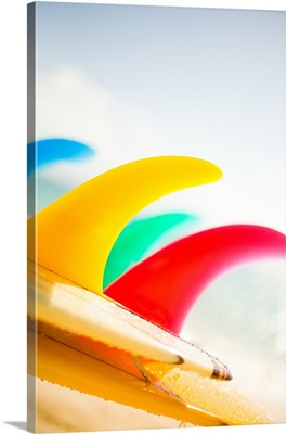 Colorful Surfboards Fins, Bright Sunny Sky In Background