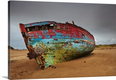 Colorful Weathered Shipwreck Lying In Sand Dunes At Crow Point, Devon, England