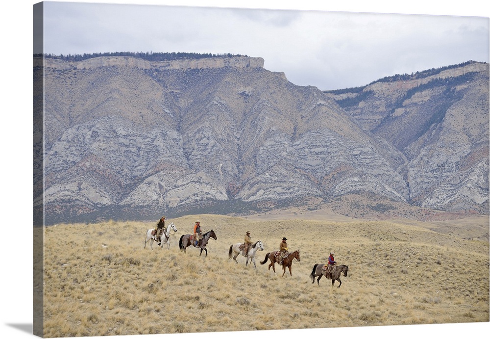 Cowboys and Cowgirls riding horse in wilderness, Rocky Mountain, Wyoming