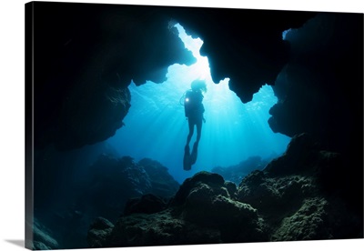 Diver Entering A Crevice At Yap Cavern's, Yap, Micronesia