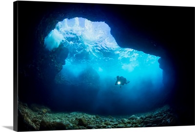 Diver Inside A Shallow Tide Pool Canyon Near Kaumalapau Harbor, Lanai, Hawaii, USA