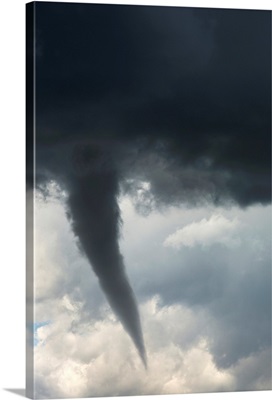 Dramatic funnel cloud created in dark storm clouds, Calgary, Alberta, Canada