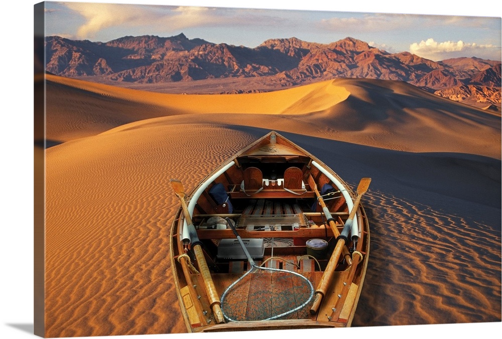 Drift boat and Death Valley National Park sand dunes. Composite.