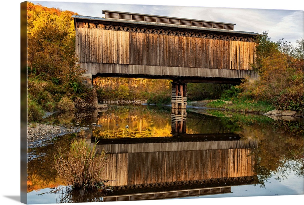 Fisher covered railroad bridge over Lamoille River in autumn, Wolcott, Vermont, United States of America.