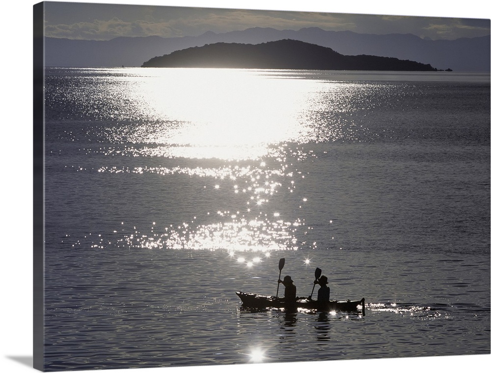 Fishermen Going Past The Island Of Domwe At Dusk; Malawi, Africa