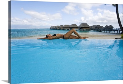 French Polynesia, Moorea, Woman Relaxing At Resort Poolside