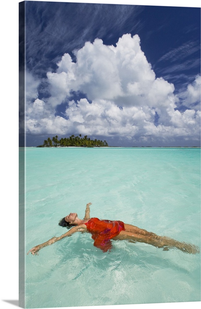 French Polynesia, Woman Floating In Ocean Water