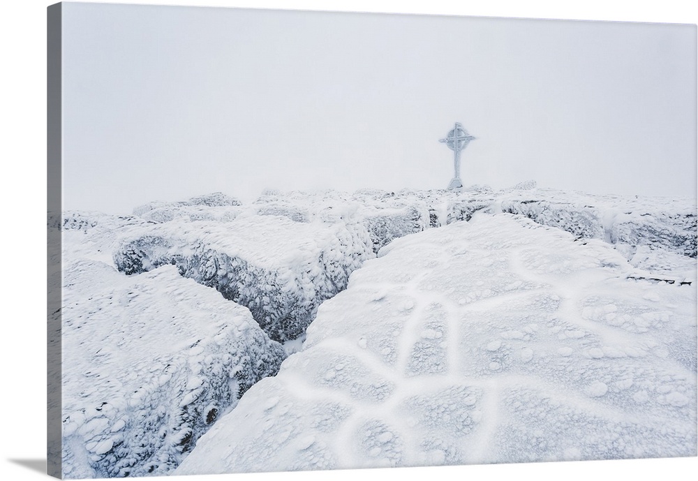 Frozen ice formations on the summit of Galtymor mountain with a celtic cross in winter, Galty Mountains; County Tipperary,...
