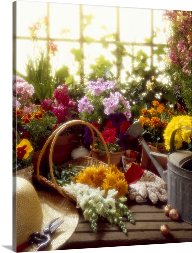 Gardener's workbench with various flowers.