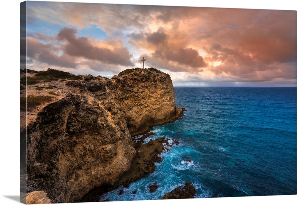 Grand-Croix at the top of the rocky peninsula of Pointe des Chateaux with a dramatic cloudy sky, Grande-Terre, Guadeloupe,...