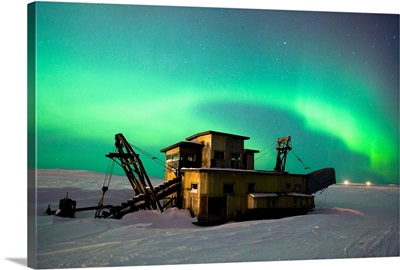 Green Northern Lights Dance Over A Historical Gold Dredge Near Nome, Alaska