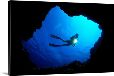 Hawaii, Big Island, Kona, Diver At Cavern Entrance With Flash Light