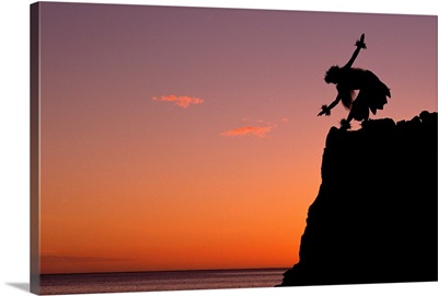 Hawaii, Female Hula Dancer Silhouetted On Cliff At Sunset