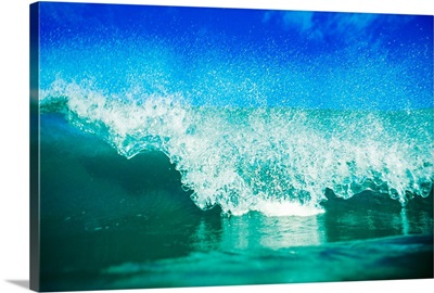 Hawaii, Green Wave Breaking Front View With Blue Skies In Background