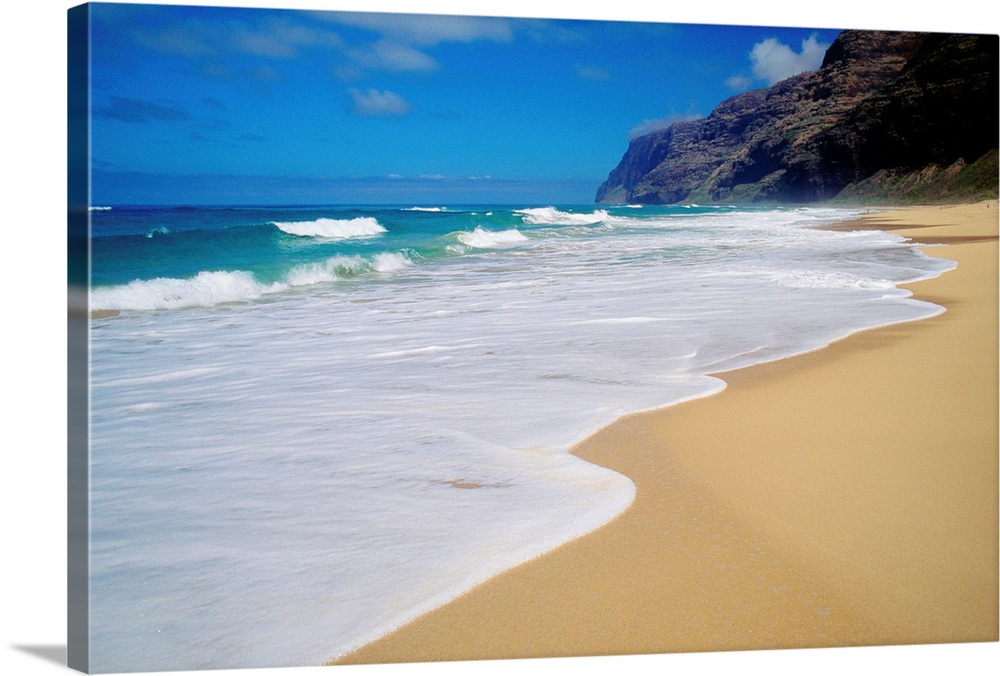 Horizontal, oversized photograph of the shoreline at Polihale Beach in Kauai, Hawaii.  A cliff and the Napali Coast are in...