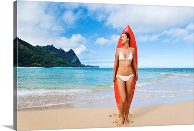 Hawaii, Kauai, Tunnels Beach, Woman Standing On Beach With Surfboard