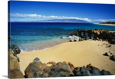 Hawaii, Lanai, Polihua Beach; Footprints In Sand, Rocks Around Beach