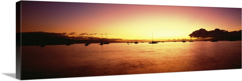 Hawaii, Maui, Boats In Ocean Near Wharf Sihouetted Against Colorful Sunset