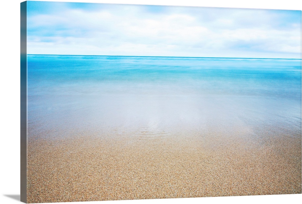 Large print of a smooth Pacific ocean meeting a Hawaiian beach.