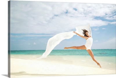 Hawaii, Oahu, Lanikai Beach, Ballet Dancer Leaping Into Air With White Flowing Fabric