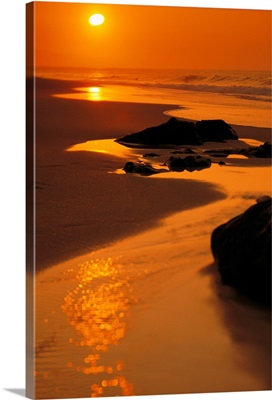 Hawaii, Oahu, North Shore, Beautiful Orange Sunset On Rocky Shoreline
