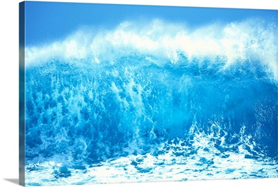 Huge Turquoise Wave Crashing Whitewash And Spray With Blue Skies