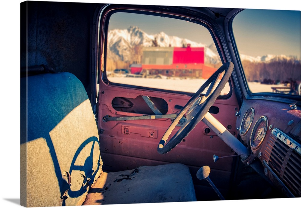 Interior view of a old, worn truck with Pioneer Peak visible out of the automobile window, South-central Alaska; Palmer, A...
