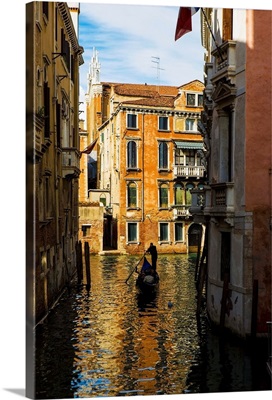 Italy, Venice, Rowing gondola through canal