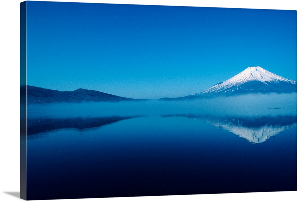 Japan, Mount Fuji, Lake Motosu, misty reflection of snowcapped mountain