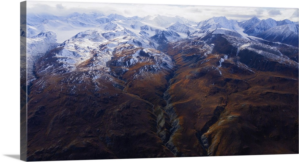 Aerial photo of Kluane national park with fall colors and snow-capped peaks as autumn fades into winter creating a breatht...