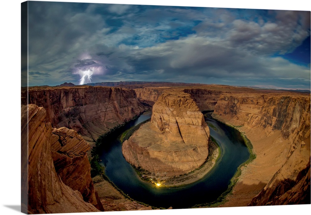Lightning strikes over the Horseshoe Bend of the Colorado River at night, Page, Arizona, United States of America