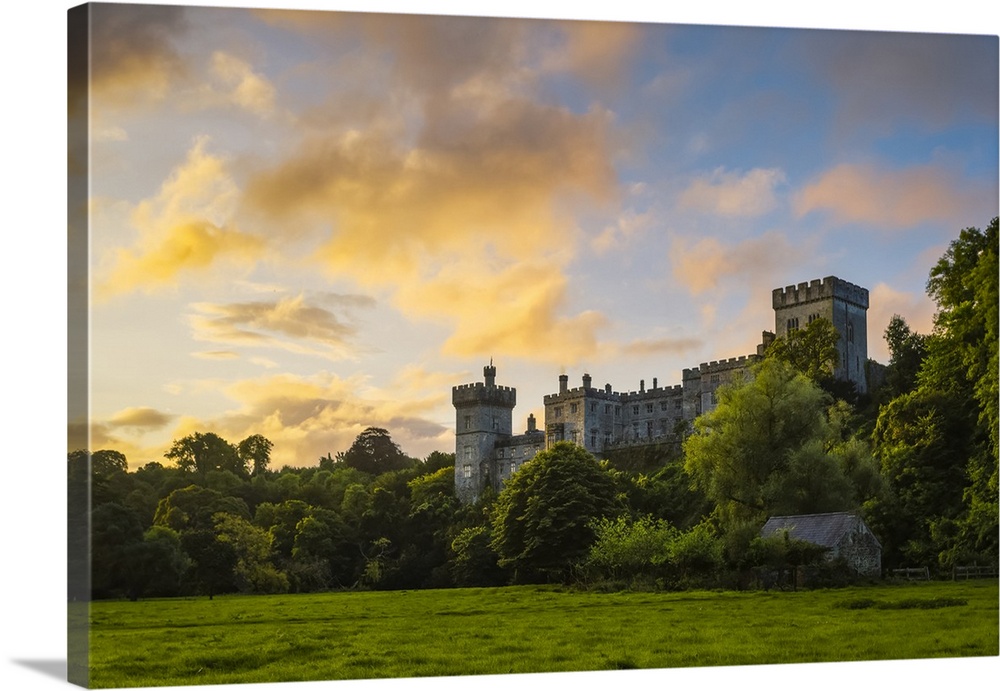 Lismore Castle at sunrise with an epic dramatic sky; Lismore, County Waterford, Ireland.