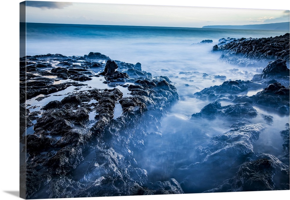 Long exposure of tide pools along the coastline and a view of the Pacific Ocean; Makawao, Maui, Hawaii, United States of A...